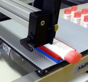 Inkjet Coder Printing Bottles on a Sliding Table